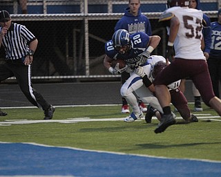  .          ROBERT  K. YOSAY | THE VINDICATOR..Polands #20  Ross Gould  Drags BDM #14 Matt Filipovich and #52 Alex Birchfield as he dives into the endzone for a score.Boardman Spartans at Poland Bulldogs Stadium