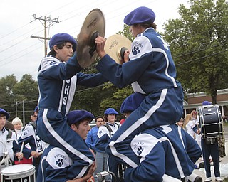  .          ROBERT  K. YOSAY | THE VINDICATOR..Yep Battle of the drum sections as Poland Students play the cymbals hoisted on bandmembers shoulders..Boardman Spartans at Poland Bulldogs Stadium