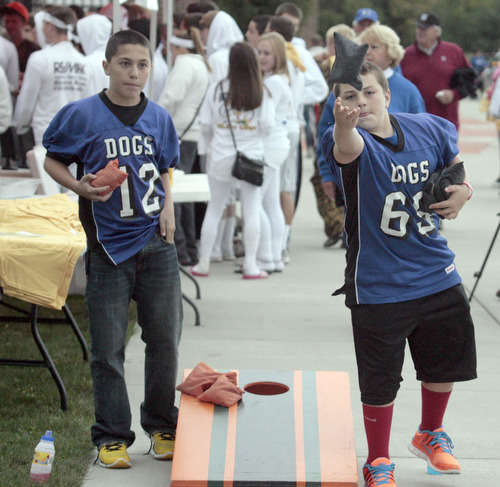  .          ROBERT  K. YOSAY | THE VINDICATOR..Andrew Parket and Zach Ellis Both from Poland and 11 years old get into a good game of Corn Hole..Boardman Spartans at Poland Bulldogs Stadium