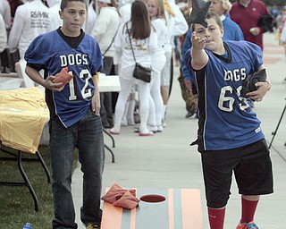  .          ROBERT  K. YOSAY | THE VINDICATOR..Andrew Parket and Zach Ellis Both from Poland and 11 years old get into a good game of Corn Hole..Boardman Spartans at Poland Bulldogs Stadium