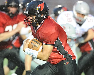 Canfield running back #9 Kimu Kim runs the football int he open field during the first half of a game on September 13, 2013 against Dover.