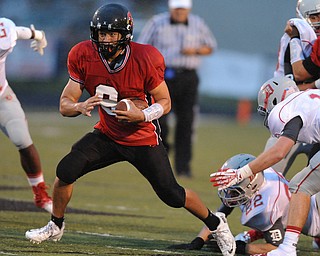 Canfield running back #9 Kimu Kim runs the football int he open field during the first half of a game on September 13, 2013 against Dover.