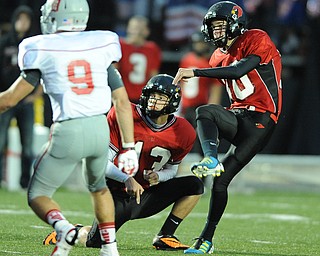 Canfield kicker #30 Bryan Kristan watches as his field goal attempt sails through the uprights for a 43 yard field goal early in the second quarter during the first half of a game on September 13, 2013 against Dover. Canfield #13 Edmond Pilolli and Dover #9 Mick Fishel pictured.