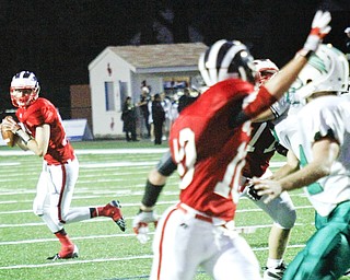 MADELYN P. HASTINGS I THE VINDICATOR..Niles Kyle Paden (19) attempts to throw the ball during their game against West Branch on September 13.