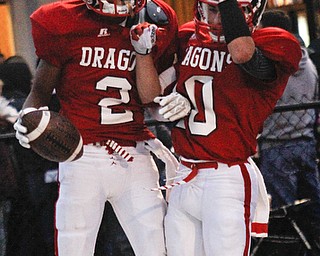 MADELYN P. HASTINGS I THE VINDICATOR..Niles Marcus Hill (2) celebrates with Chris Parry (10) after scoring a touchdown during their game against West branch on September 13.