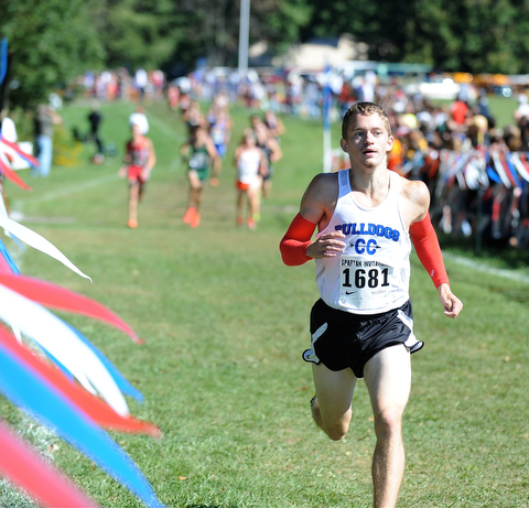 A Lakeview runner sprints to the finish line during the Boys Division 2 race on Saturday September 14, 2013 at Boardman High School.