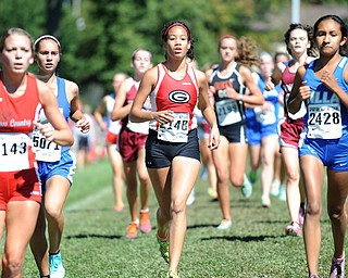 A Girard runner sprints in the pack on the back stretch during the Girls Division 2 race on Saturday September 14, 2013 at Boardman High School.