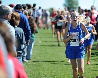 A Poland runner runs down the front straight away during the Girls Division 2 race on Saturday September 14, 2013 at Boardman High School.