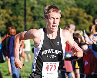 Howland’s Ryan Sullivan sprints to the finish line at the Suburban League cross country championship Tuesday at the Canfield Fairgrounds. Sullivan won the individual race with a time of 16:27.12.