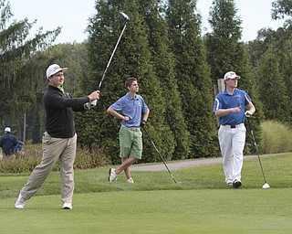        ROBERT K. YOSAY  | THE VINDICATOR..Killing the drive on 18 is Vince Hynes of Lowellville a senior .. watching is  Chance Proverbs 10thgrader from Jackson Milton ( green shorts)  and Noland Snyder a junior from Western Reserve ITCL boys golf tournament--  Pine Lakes Golf Club, Hubbard.. - -30-..