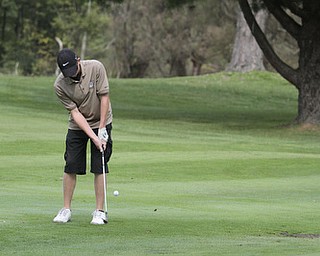        ROBERT K. YOSAY  | THE VINDICATOR..Lineing up his chip is Phil Gerner from East Palestine a junior ..ITCL boys golf tournament--  Pine Lakes Golf Club, Hubbard.. - -30-..