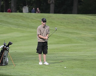        ROBERT K. YOSAY  | THE VINDICATOR..Lineing up his chip is Phil Gerner from East Palestine a junior ..ITCL boys golf tournament--  Pine Lakes Golf Club, Hubbard.. - -30-..