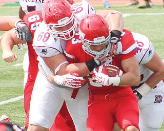 For the first time in school history, Youngstown State will take on the Dukes of Duquesne University — its nearest FCS neighbor — which boasts two Valley natives on the roster: Poland’s E.J. Kosec and Boardman’s Zach
Zidian (69), above.