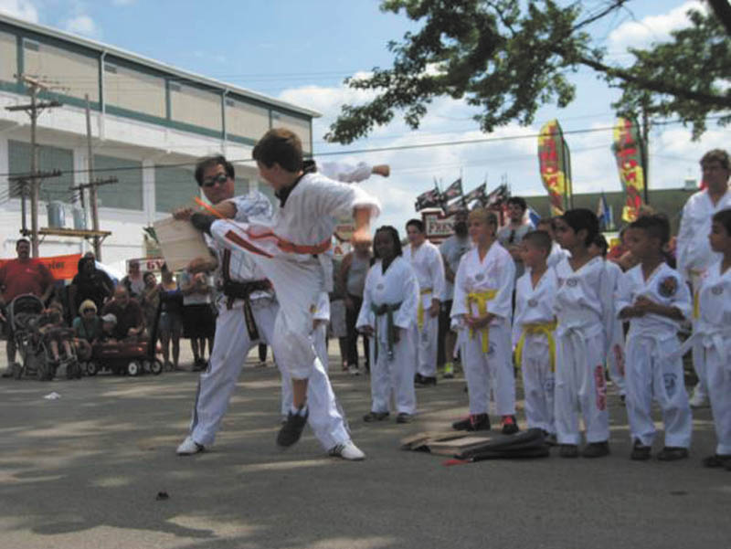 SPECIAL TO THE VINDICATOR
During the Canfield Fair, Master Park Martial Arts International conducted a Hi-Ya (shouting) Challenge. Following are some of the benefits that are said to come from practicing Hi-Ya: improved breathing and lung capacity, less stress, more energy, improved concentration, learning discipline, and developing confidence, strength and balance. Here, contestants present their overall shouting with breathing techniques. The next Hi-Ya competition will be Sept. 29 at the Maag Outdoor Theatre during the Rotary Oktober Festival at Boardman Park. Registration begins at 11 a.m. Participants, sponsors and award donations are needed. All donations and sponsorship fees will go to the Boardman Rotary Community Project. For information or to register contact Master Park Martial Arts Boardman at 224 Boardman-Canfield Road, visit www.masterpark.com, email masterpark@masterpark.com or call 330-965-9000.