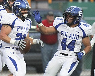 William D Lewis The Vindicator  Poland's Ross Gould (20) gets congrats from Jake Aiello (44) after scoring during first quarter action Friday 9-220-13  at Niles.