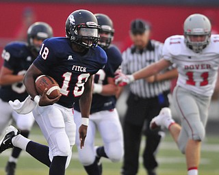 Fitch quarterback #18 Antwan Harris breaks away from the pack to score the first Fitch touchdown on the night on a 4th and 1 play in the 1st quarter. Dover #11 Alex Bowman pictured.