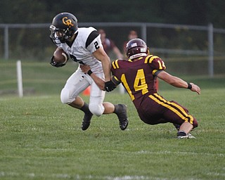  .          ROBERT  K. YOSAY | THE VINDICATOR..First Quarter action  as Crestveiws#2 Trevor Cope breaks free of SR #14   Bryce Allen as he runs around end for a first downCrestview @ South Range in North Lima