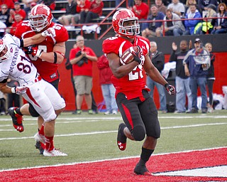 MADELYN P. HASTINGS | THE VINDICATOR..YSU's Martin Ruiz (29) scores a touchdown while Brock Eisenhuth stops Duquesne's E.J. Kosec (31) during their game at Stambaugh Stadium on Saturday, September 21. .... - -30-..