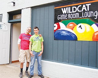 Sam Awadallah, left, opened a game room with the help of his 15-year-old son, Ridge, on Elm Street in Struthers. The pair hope to attract the after-school crowd to off er them a safe, fun environment for some leisure time.