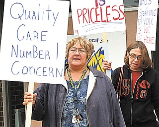 ValleyCare Northside Medical Center registered nurses, holding signs for today’s one-day strike at the hospital on Gypsy Lane on Youngstown’s North Side, stand in front of Teamsters Local 377 hall Monday, where they received a final briefing on their strike duties.