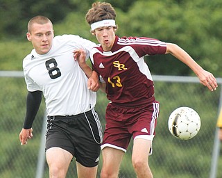 Crestview’s Greg Bable (8) and South Range’s Jonah Wilson (13) battle for control of the ball during a match on Monday.