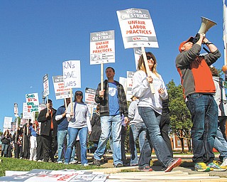 Led by Nate Gunderson with the bullhorn, organizer for the American Federation of Teachers, Northside
Medical Center registered nurses, represented by the Youngstown General Duty Nurses Association, marched during a one-day strike Tuesday in front of the hospital at 500 Gypsy Lane. The AFT is the national union with which the Ohio Nurses Association is affiliated. The ONA is the bargaining agent for the Northside nurses.