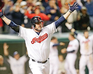 Cleveland Indians’ Jason Giambi reacts after hitting a two-RBI home run off Chicago White Sox relief pitcher Addison Reed in the ninth inning of a game Tuesday in Cleveland. The Indians won 5-4.