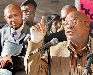 Artis Gillam speaks outside the Mahoning County Board of Elections 9-25-13 during a rally protesting County Dem party chrm Dave Betras' action concerning black party committee members. At left is Rev Kenneth Simon, New Bethel Baptist Church. Gillam a former city councilman and Dem party committee member  was  fired by Betras.
