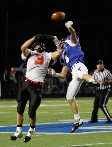  .          ROBERT  K. YOSAY | THE VINDICATOR..Polands #4  Dylan Garver knocks the ball away from Canfields #3 Drew Rogers.. during second quarter action at  Poland..Canfield at Poland