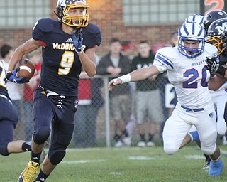 William d Lewis the Vindicator  McDona;d's (9) eludes Western Reserve's(20) during 1rst haslf action 9-27-13 in Mcdonald.