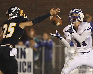 William d Lewis the Vindicator Western Reserve's (11) pulls in a TD pass during 1rst half action 9-27-13 at McDonald.Defending for McDonald is (25