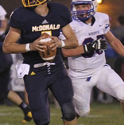 William d Lewis the Vindicator McDonald (7) eludes Western Reserve's (35) during 1rst half action 9-27-13 at McDonald.