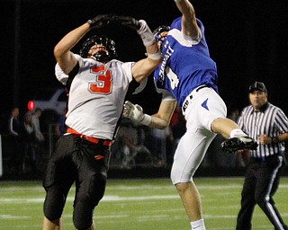 . ROBERT K. YOSAY | THE VINDICATOR..Polands #4 Dylan Garver knocks the ball away from Canfields #3 Drew Rogers.. during second quarter action at Poland..Canfield at Poland