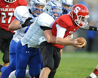 David W. Dermer | The Vindicator.Struthers quarterback #12 Gary Muntean is sacked by Hubbard defensive linemen #78 Jake Frost and linebacker #6 Cole Benectic during the 1st quarter of a game on September 27, 2013.
