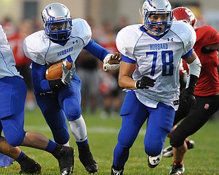 David W. Dermer | The Vindicator.Hubbard running back #3 LJ Scott follows his offensive linemen #78 Jake Frost for a big gain during the 1st quarter of a game on September 27, 2013.