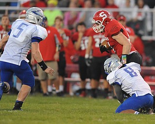 David W. Dermer | The Vindicator.Struthers running back #21 Nick Pollifrone can not escape the tackle of Hubbard #8 Brandan Rivers and #5 alex Mosora on a running play during the 1st quarter of a game on September 27, 2013.