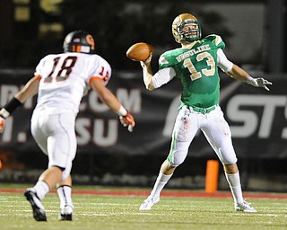 Ursuline quarterback #13 Chris Durkin throws the ball across the field avoiding pressure from Cathedral Prep defensive back #18 Jacob Galla.