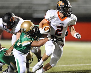 Cathedral Prep running back #2 Jake DeHart runs the ball through would be Ursuline tackler #50 ShaHaun Williams on a big run in the 3rd quarter.