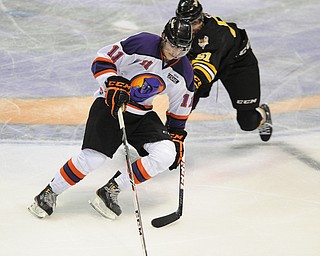 Phantoms #11 Fredric Larsson keeps the puck away from Green Bay #51 Brent Gates Jr. as the two battle for the puck during the 3rd period.