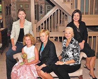 Helping with an annual Youngstown Area Federation of Women’s Clubs fundraiser are, left to right, Tamara Sigler, Ava Wilson, Barbara Geller, Suzanne Brown and Leah Wilson. The luncheon event, to benefit Youngstown State University scholarships, will begin at 11:30 a.m. Oct. 16 at the Holiday Inn in Boardman.