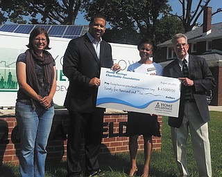 SPECIAL TO THE VINDICATOR
The Youngstown Neighborhood Development Corp. recently received a $25,000 donation from Home Savings Charitable Foundation to help with the construction costs of a community workshop facility and needed equipment for neighborhood improvement. Above, from left, are Liberty Merrill, senior program coordinator of YNDC; Presley L. Gillespie, executive director of YNDC; June Johnson, CRA assistant of Home Savings; and Richard Shafer, vice president mortgage loan services and CRA officer of Home Savings.