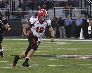 Youngstown State's Kurt Hess scrambles for eleven yards to convert a third down and ten during the first quarter of Saturday's matchup at Southern Illinois University in Carbondale Illinois. Dustin Livesay | The Vindicator 9/28/13 Carbondale Illinois.