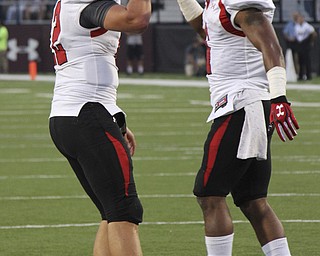 Youngstown State's Kurt Hess (left) and Andre Stubbs (right) celebrate after they connected for a touchdown during the first quarter of Saturday's matchup at Southern Illinois University in Carbondale Illinois. Dustin Livesay | The Vindicator 9/28/13 Carbondale Illinois.