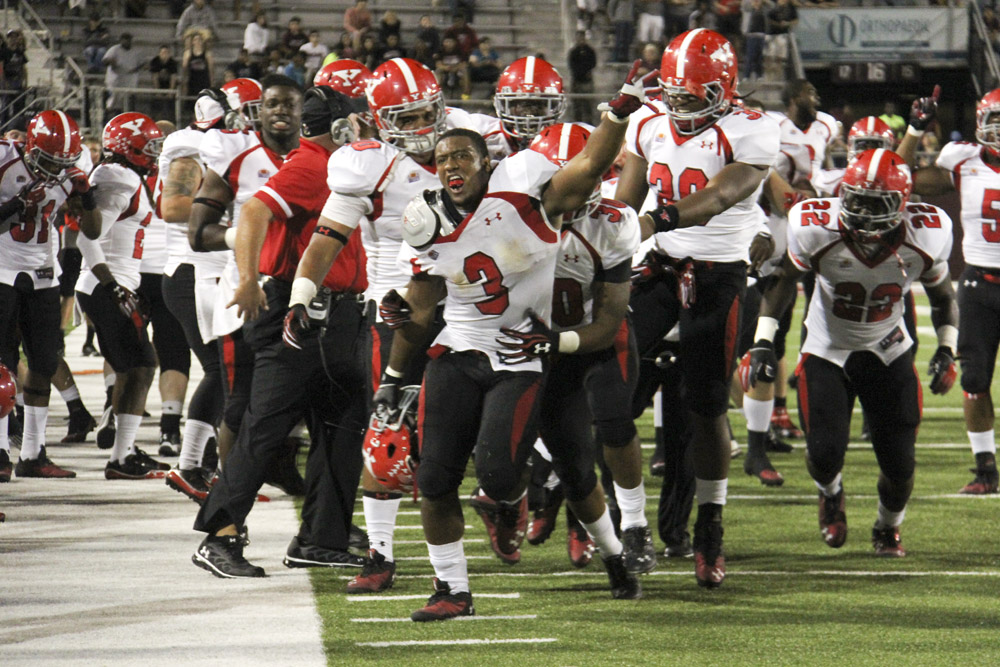 Youngstown State's Teven Williams (3) celebrates with his team after forcing a fumble to seal the victory for the Penguins against Southern Illinois University. The Penguins won the matchup on Saturday night 28-27 against the Salukis. Dustin Livesay  |  The Vindicator  9/28/13  Carbondale Illinois.