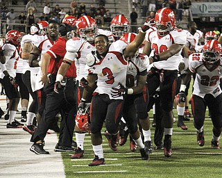 Youngstown State's Teven Williams (3) celebrates with his team after forcing a fumble to seal the victory for the Penguins against Southern Illinois University. The Penguins won the matchup on Saturday night 28-27 against the Salukis. Dustin Livesay | The Vindicator 9/28/13 Carbondale Illinois.