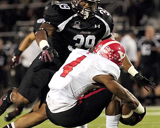 Youngstown State's Andre Stubbs tries to change directions against Southern Illinois' Dinnus Harding on a kick return during the first half of the teams game at Saluki Stadium on Saturday, Sept. 28, 2013, in Carbondale, Ill. (Paul Newton / The Southern)