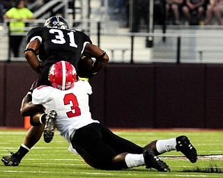 Youngstown State's Teven Williams tries to drag down Southern Illinois' Malcolm Agnew during the first half of the teams game at Saluki Stadium on Saturday, Sept. 28, 2013, in Carbondale, Ill. (Paul Newton / The Southern)