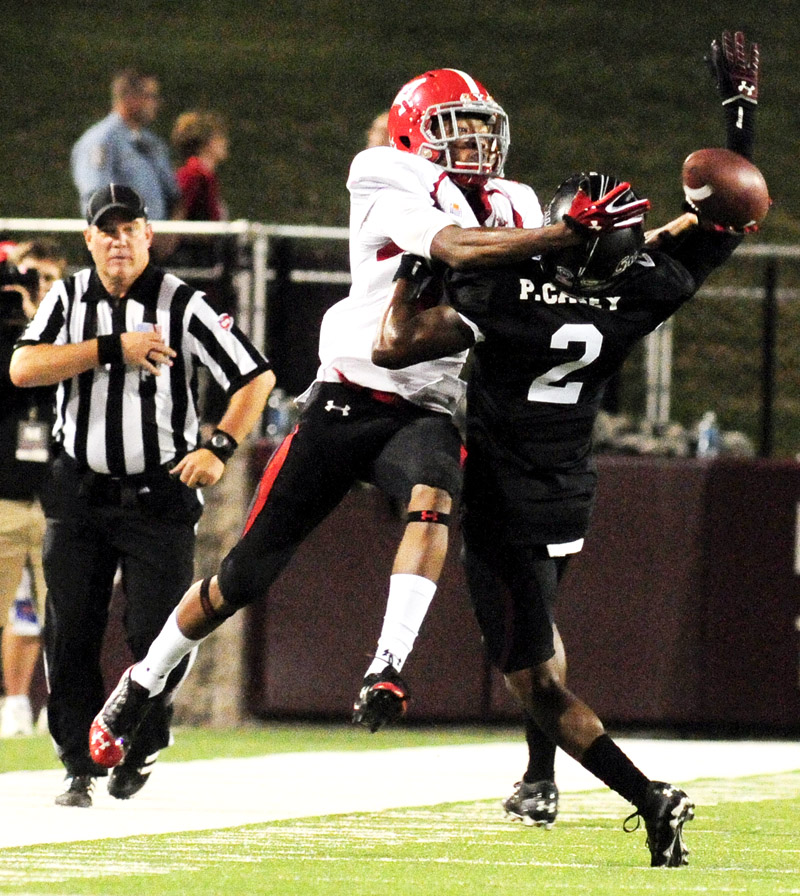 Youngstown State's Marcel Caver tries to catch a  ball as Southern Illinois' Courtney Richmond defends him during the second half of the Salukis' 28-27 loss to the Penguins at Saluki Stadium on Saturday, Sept. 28, 2013, in Carbondale, Ill. Caver was called for pass interference on the play. (Paul Newton / The Southern)