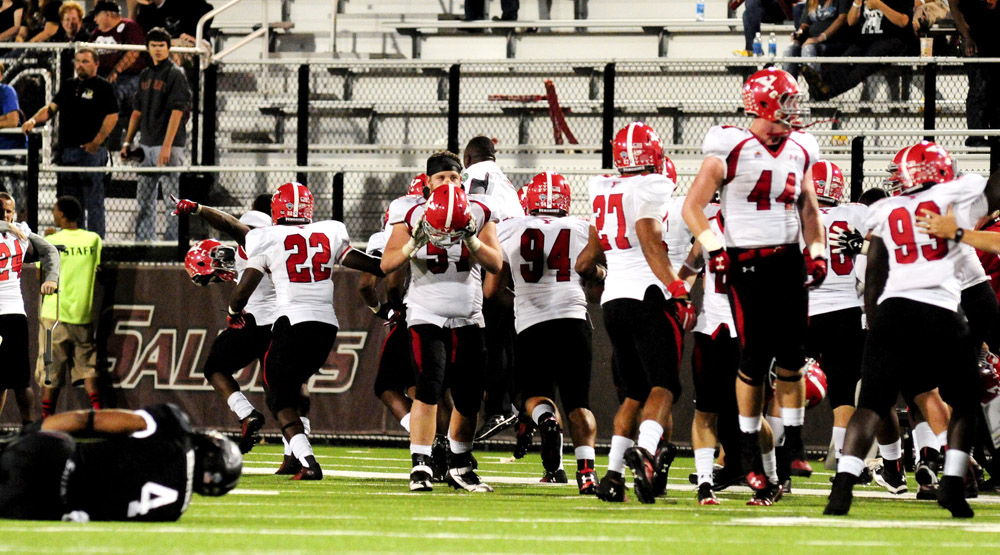 Southern Illinois' MyCole Pruitt sits injured on the field after a late-game fumble that solidified the win for Youngstown State during the second half of the Salukis' 28-27 loss to the Penguins at Saluki Stadium on Saturday, Sept. 28, 2013, in Carbondale, Ill. (Paul Newton / The Southern)