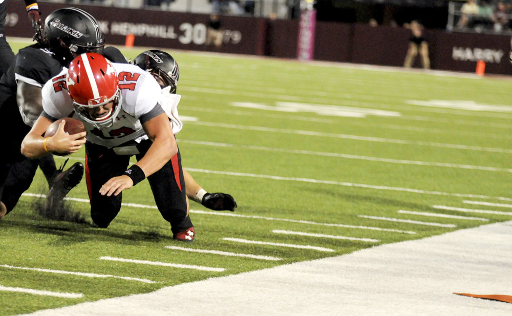 Youngstown State's Kurt Hess reaches out for a first down on a fourth-down run late in the game during the second half of the Salukis' 28-27 loss to the Penguins at Saluki Stadium on Saturday, Sept. 28, 2013, in Carbondale, Ill. (Paul Newton / The Southern)